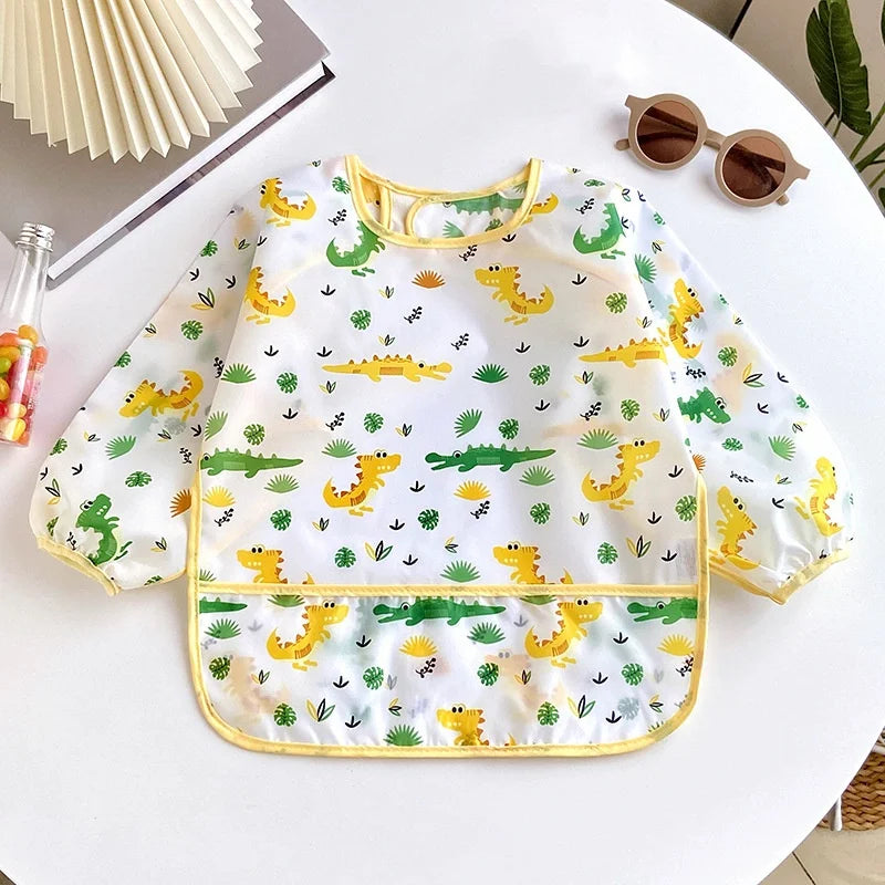 Ansoff waterproof baby bib for girls and boys with long sleeves, cartoon design, adjustable feeding cloth, ideal for toddlers' meals.