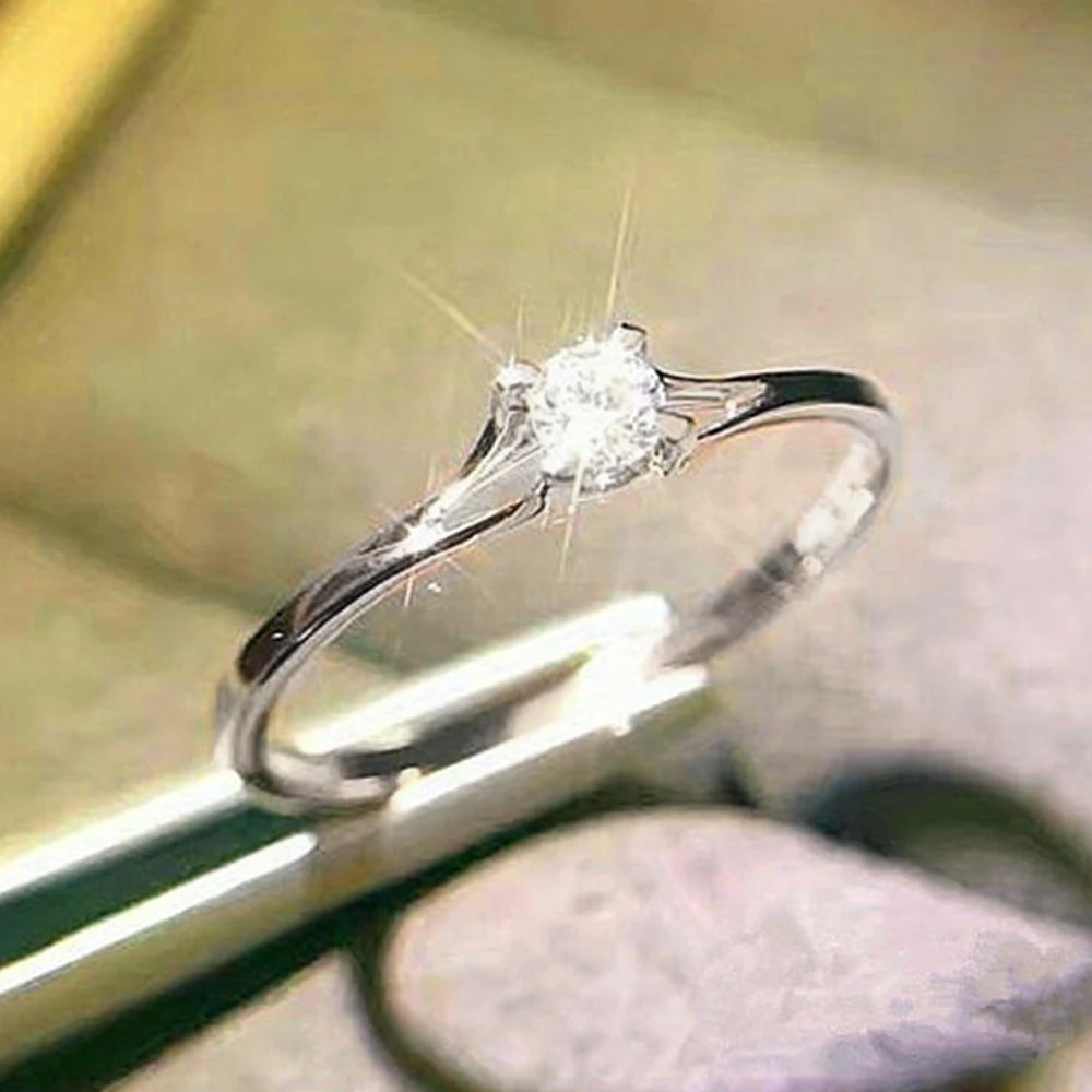 Elegant women's wedding ring by Ansoff with 4MM cubic zirconia, minimalist design, simple and stylish for engagement or special occasions.