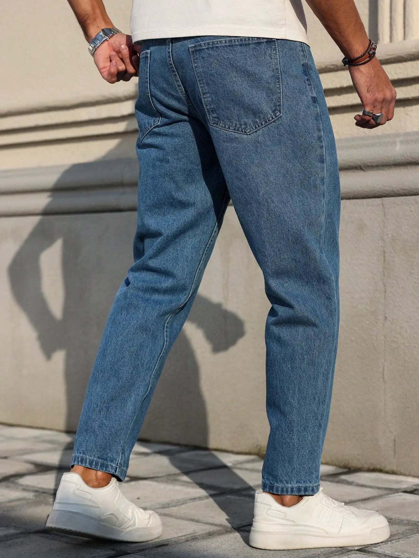 Men's blue denim jeans by Ansoff with a loose fit, showcasing classic fabric and versatile style in a casual wardrobe staple.