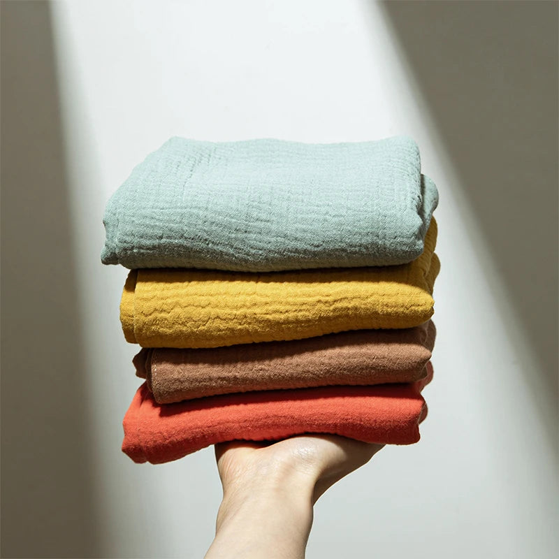 Soft baby towel and bathrobe set from Ansoff, featuring a comfortable, solid cotton design for newborns and kids.