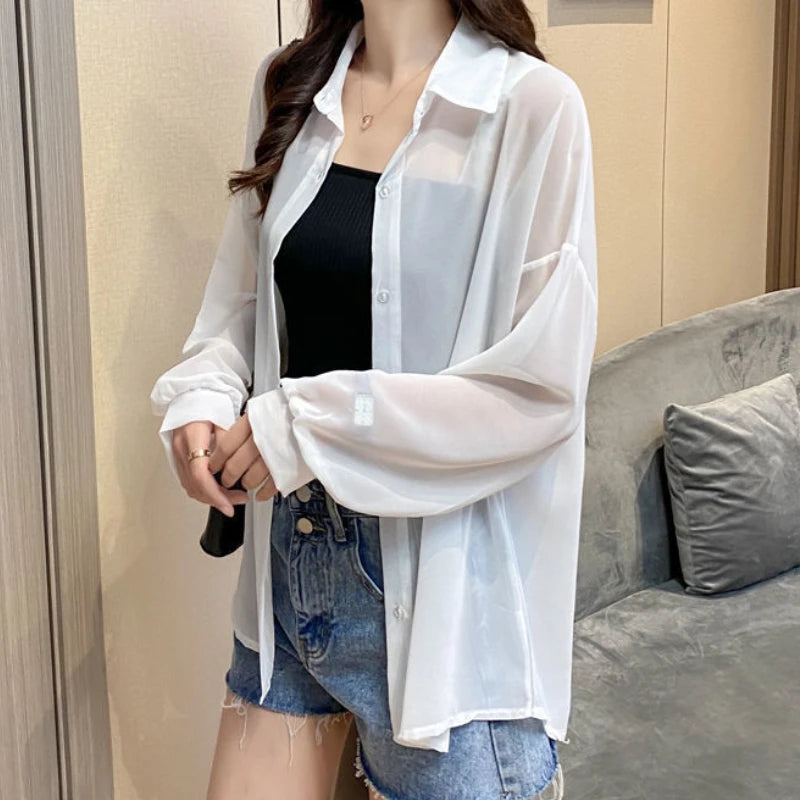 Women's sheer sun-proof summer shirt by Ansoff featuring long sleeves, turn-down collar, and elegant solid design.