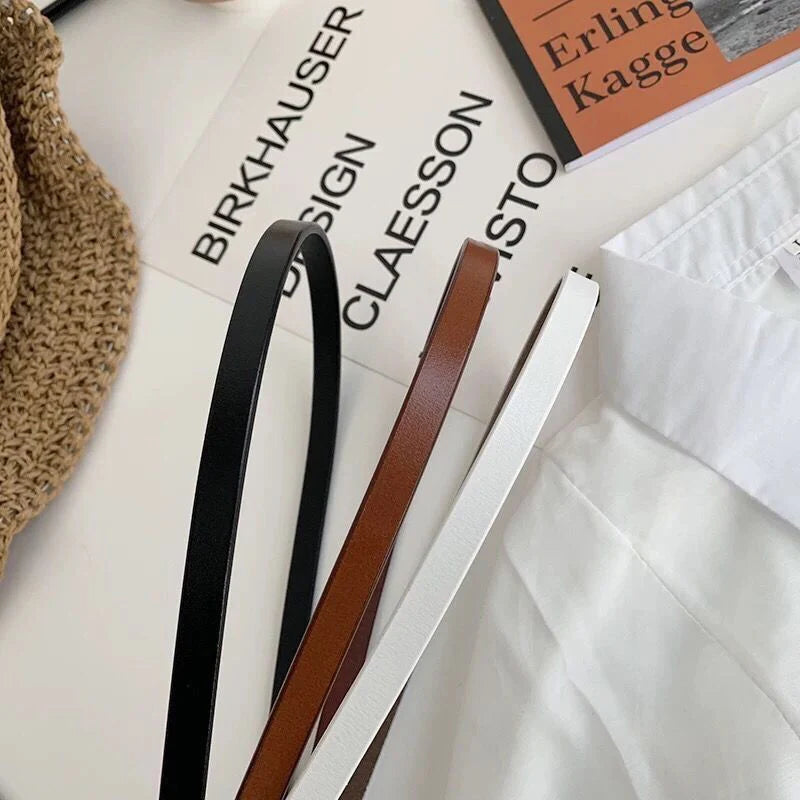 Ansoff women's thin leather belt in white and black with a bow, loop strap design, perfect for dresses and coats.