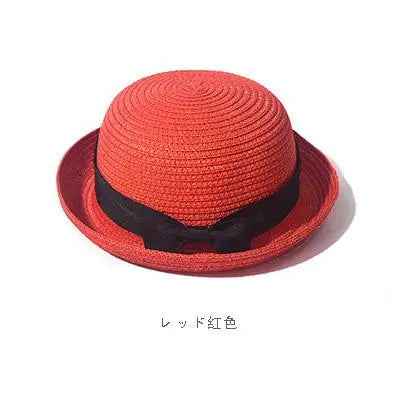 Ansoff women's straw sun hat with a round top and curled brim, perfect for summer sun protection and travel.
