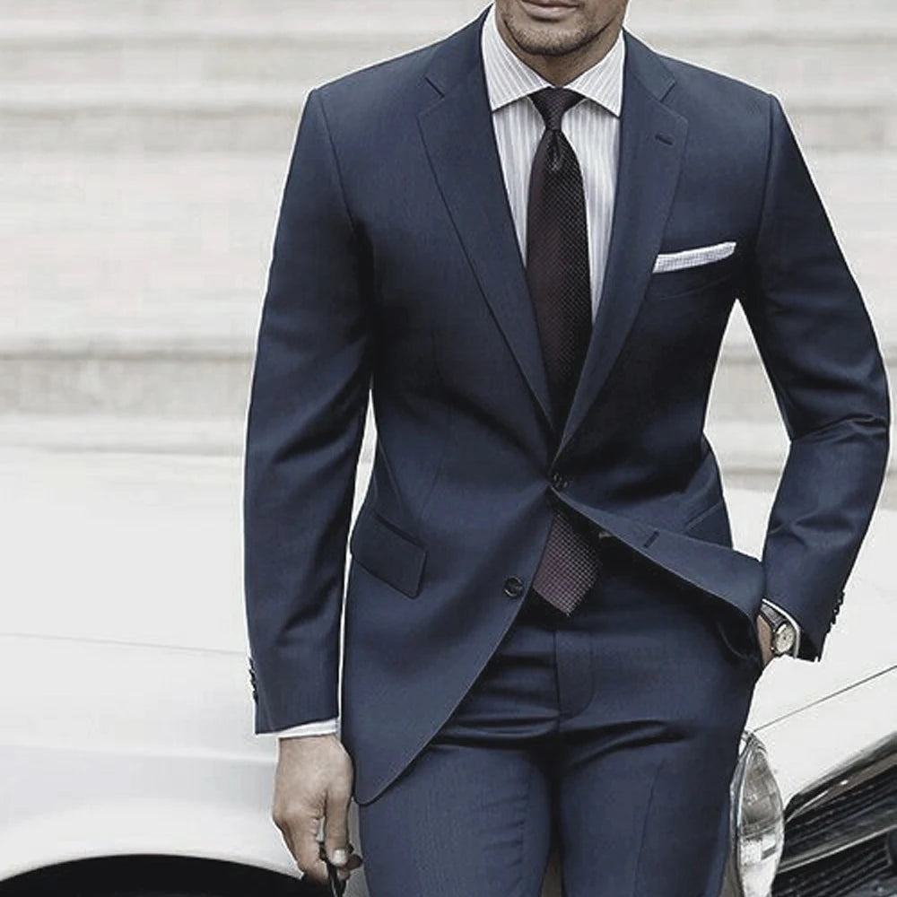 Ansoff tailored men's wedding suit in blue-grey with matching pants, custom-made for a sophisticated wedding or formal event.