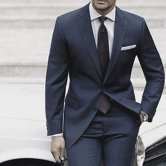 Ansoff tailored men's wedding suit in blue-grey with matching pants, custom-made for a sophisticated wedding or formal event.