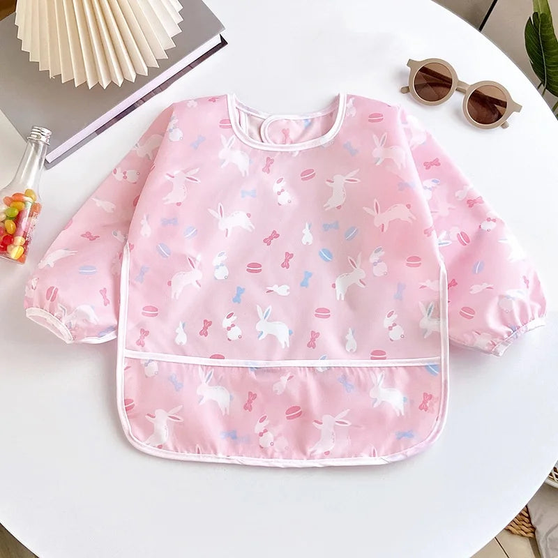 Ansoff waterproof baby bib for girls and boys with long sleeves, cartoon design, adjustable feeding cloth for toddlers' meals.