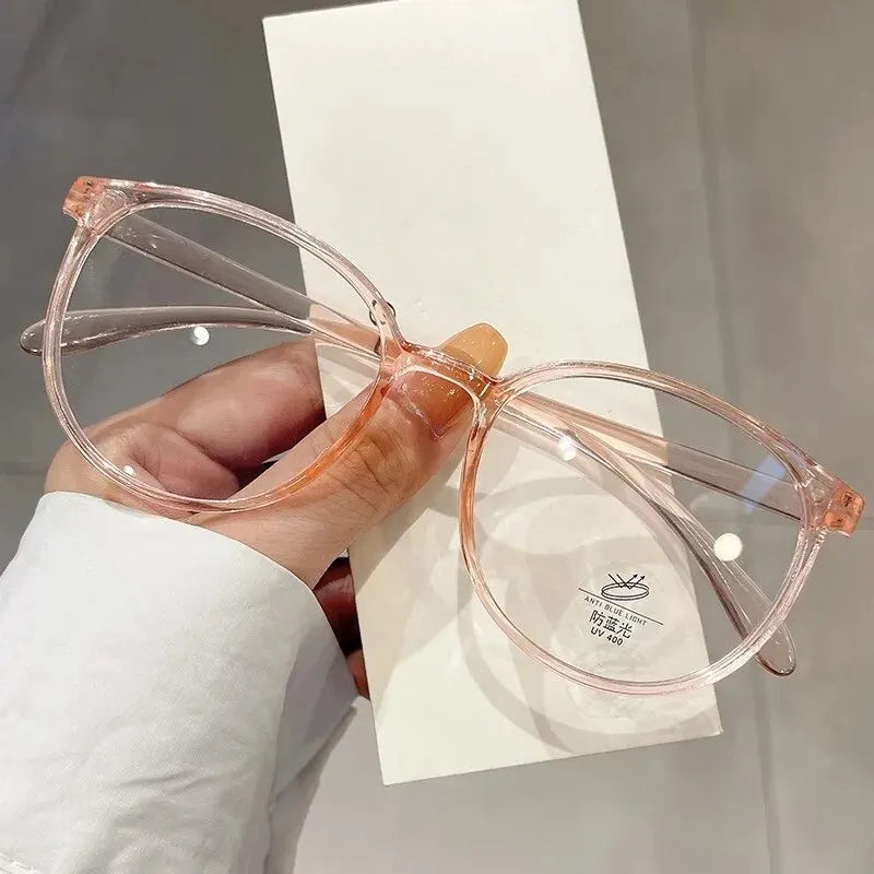 Clear anti blue light blocking glasses by Ansoff with replaceable lenses, designed for women and men to reduce eye strain.