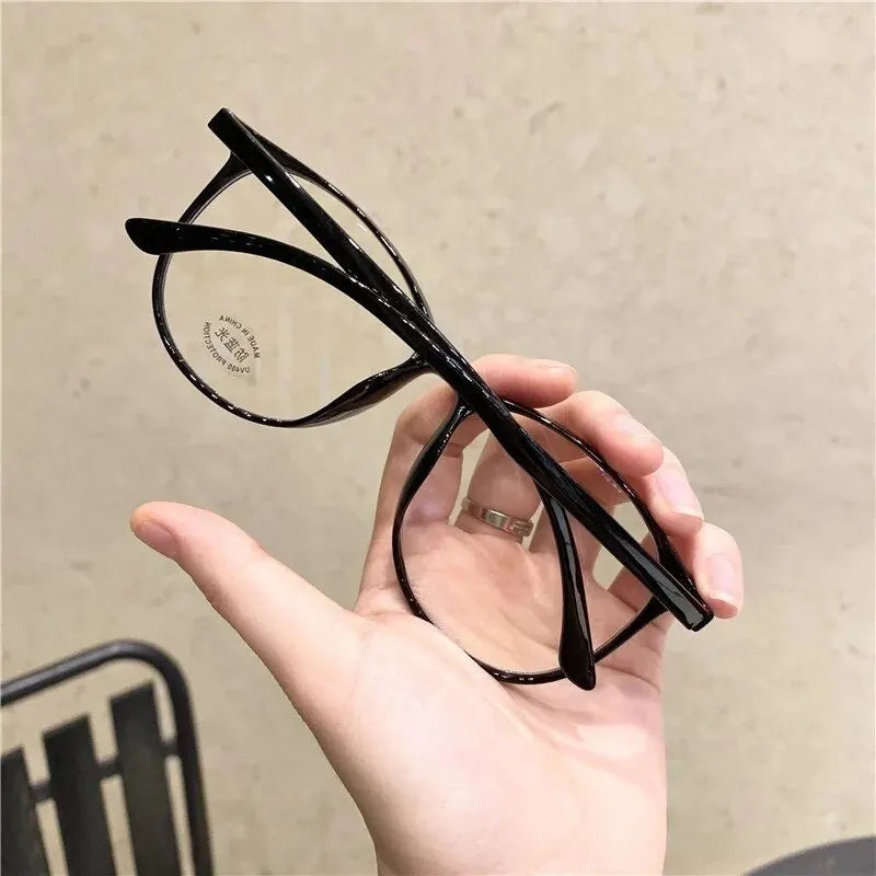 Clear anti-blue light blocking glasses by Ansoff with replaceable lenses, designed for women and men to reduce eye strain.