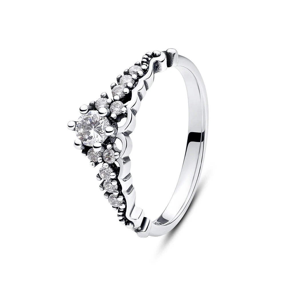 Sterling silver rings for women by Ansoff featuring crown, love heart, wishbone, and rose gold crystal details in luxury jewelry style.