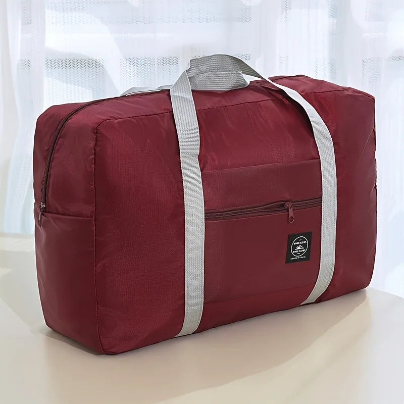 Ansoff foldable large capacity travel luggage bag, expandable sports carry-on with check-in size and multiple compartments.