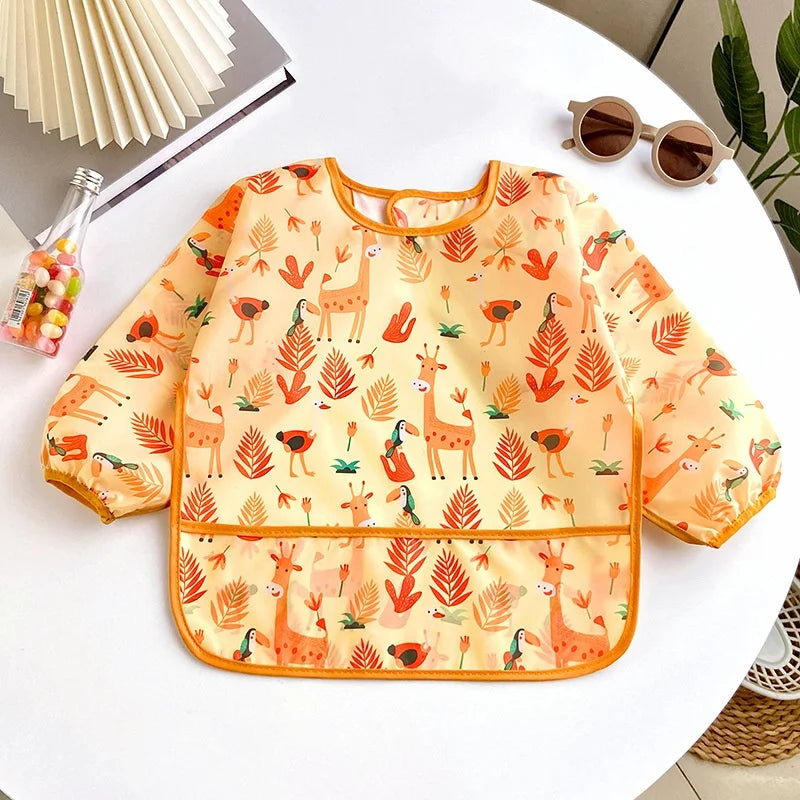 Ansoff waterproof cartoon baby bib with long sleeves, adjustable feeding apron for girls and boys, ideal for toddlers' meals and painting.
