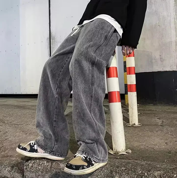 Black and light blue loose straight streetwear jeans for men by Ansoff, featuring a Korean style wide-leg fit.