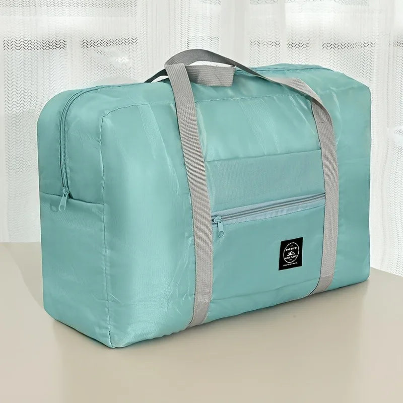 Ansoff foldable large capacity travel luggage bag, expandable sports carry-on and weekend check-in bag, in black with handles and wheels.