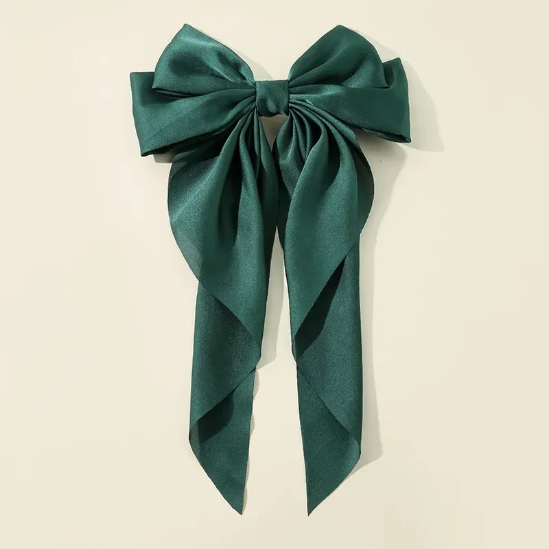 Ansoff Korean hair clips for women and girls featuring large satin bowknot ribbons and spring clamp barrettes.