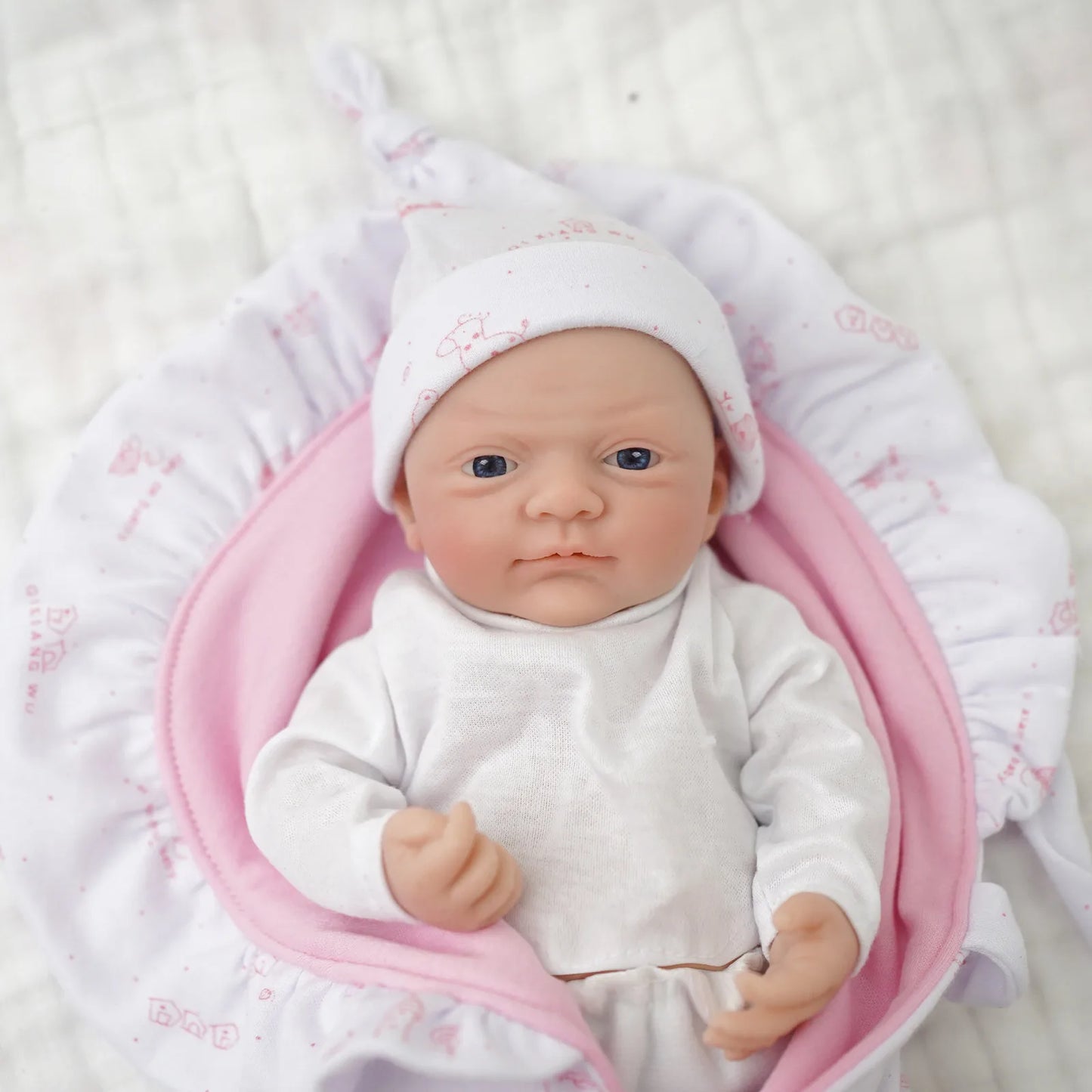 Realistic 12-inch Reborn Baby Doll by Ansoff, micro preemie silicone boy with open eyes and detailed newborn features.