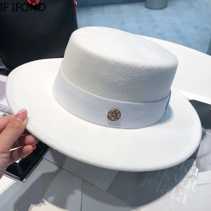Elegant women's Fedora hat by Ansoff with a ribbon band, suitable for weddings, church, or fashion events, in felt material.