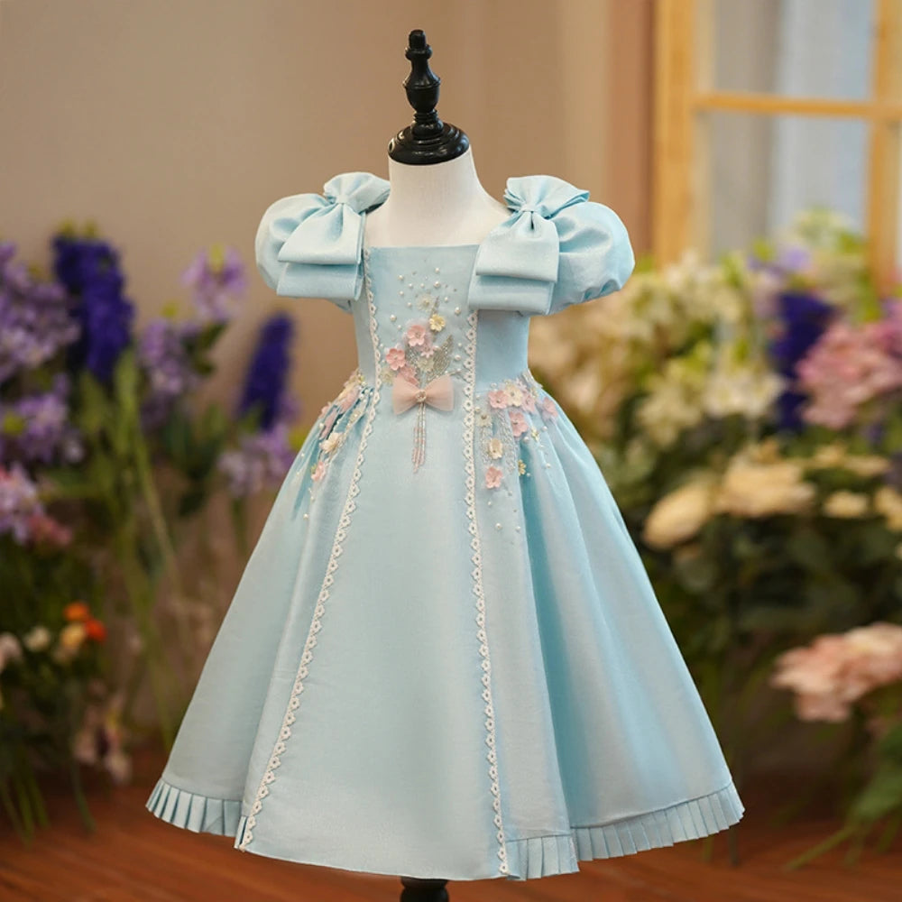 Light blue square neck puff sleeve princess dress for girls, featuring beads and A-line design, ideal for birthday parties and performances.
