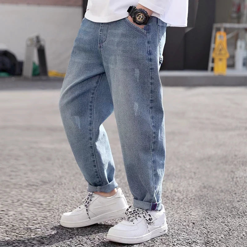 Kids' denim jeans by Ansoff, boys' cowboy style sports pants in size 4 to 12, featuring classic denim design and durable fabric.