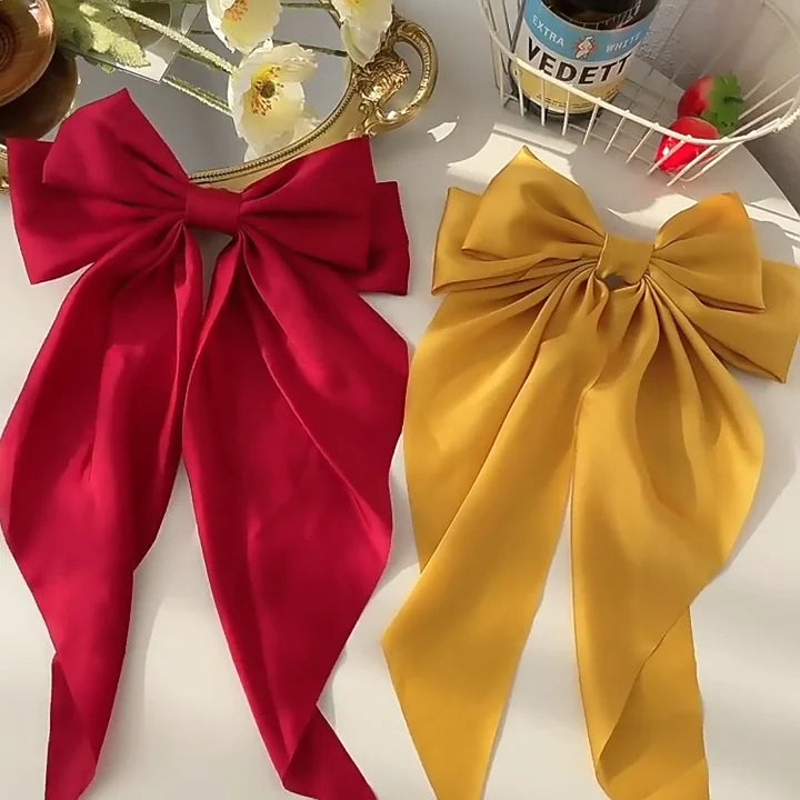 Ansoff Korean hair accessories featuring a large satin bowknot with long ribbon, spring clamp for women and girls.