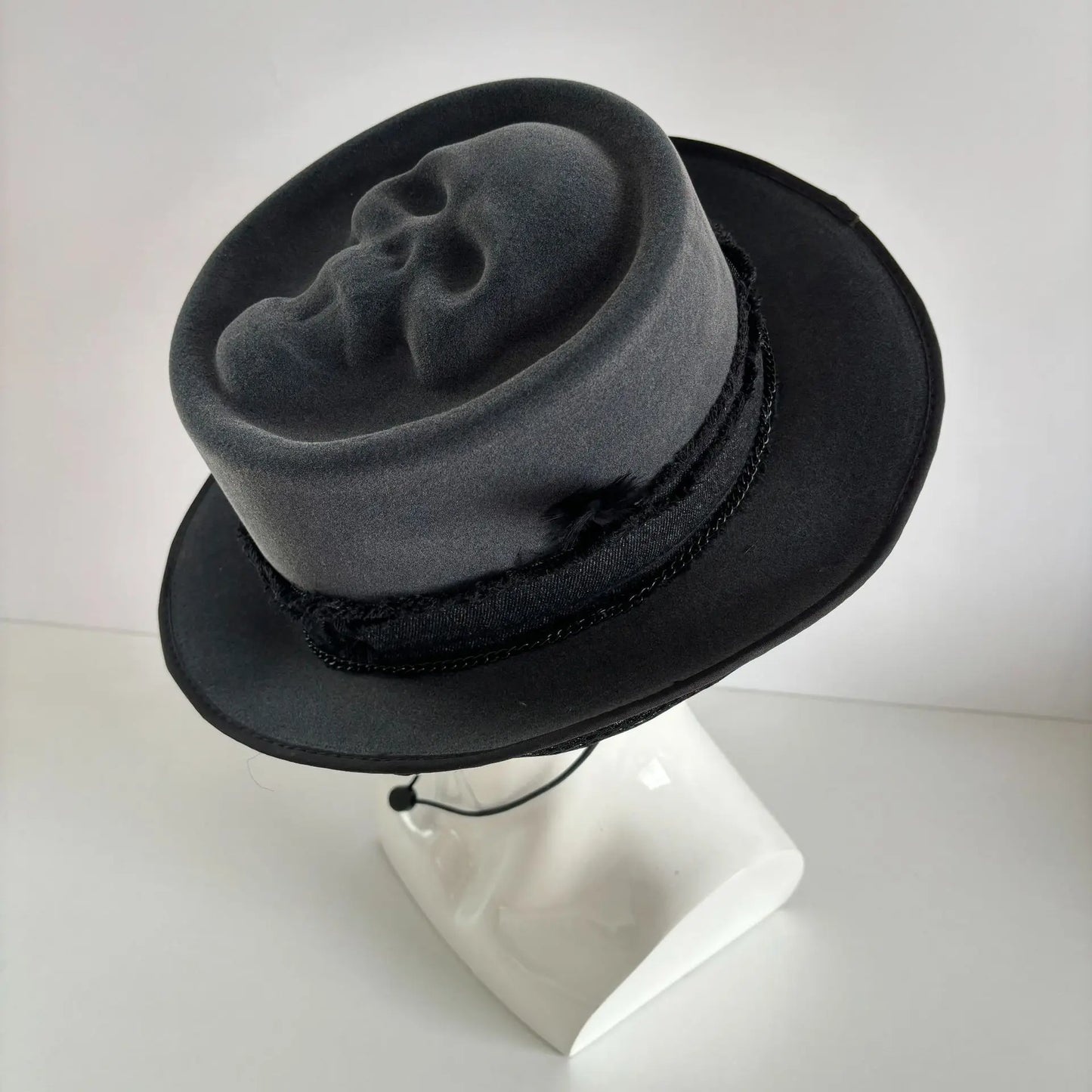 Black Gothic cowboy hat by Ansoff featuring skull ornament, spooky Halloween headwear suitable for festivals and costume parties.