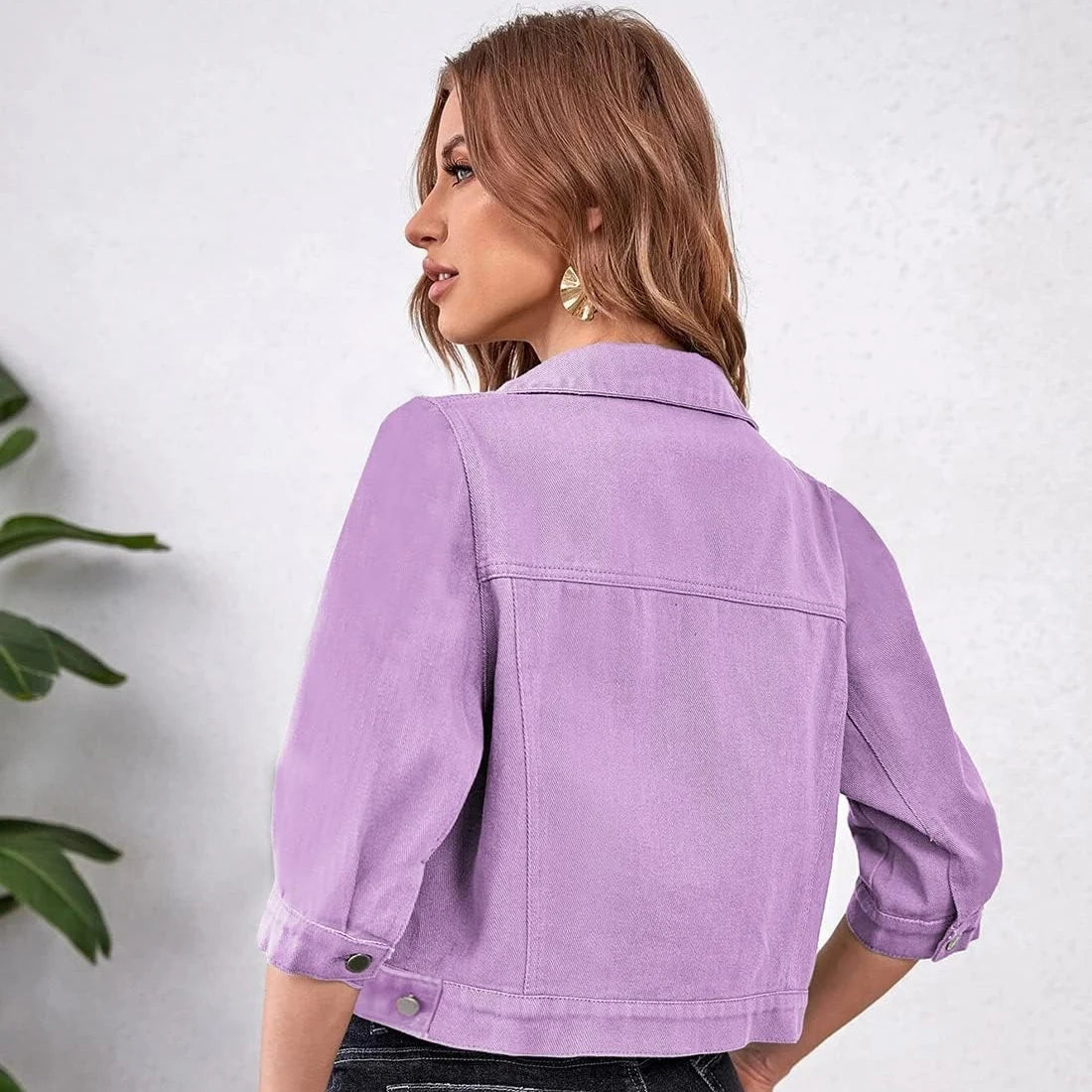 Ansoff women's cropped denim jacket with puff sleeves, distressed details, purple, yellow, white, and blue colors, with front pockets.