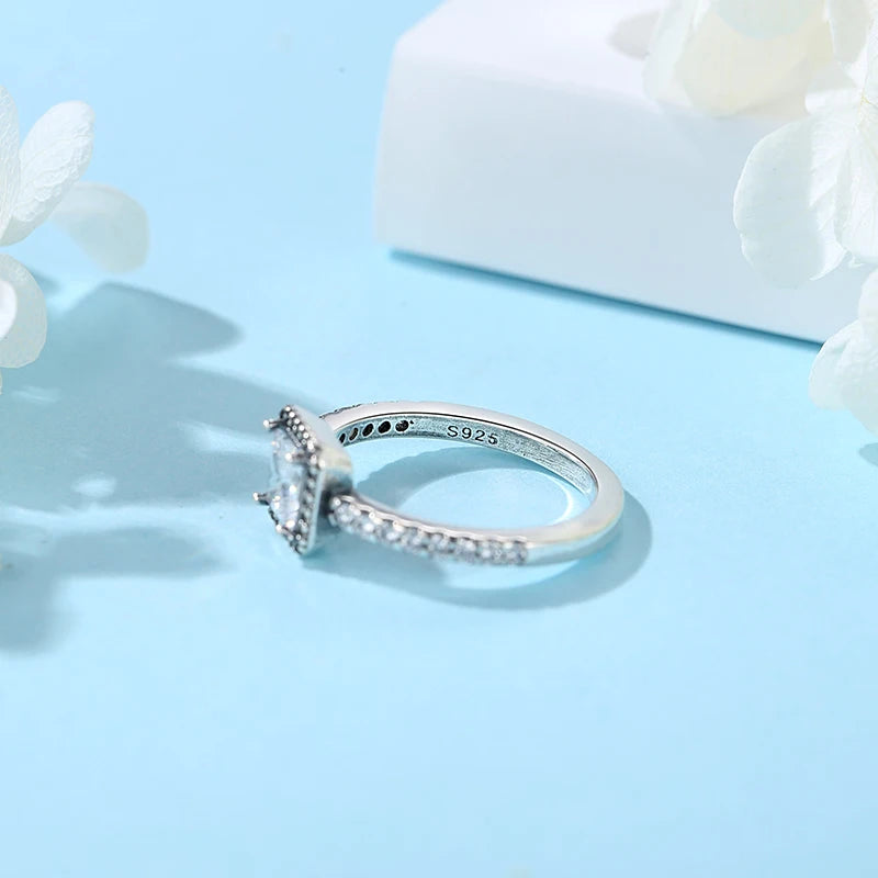 Sterling silver women's ring with crown, love heart, and wishbone design, featuring rose gold accents and crystal embellishments.