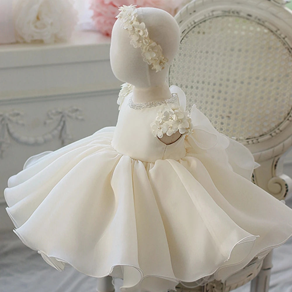 Kids princess gown by Ansoff featuring a white tulle fabric, 3D flower design, perfect for weddings, parties, and performances.
