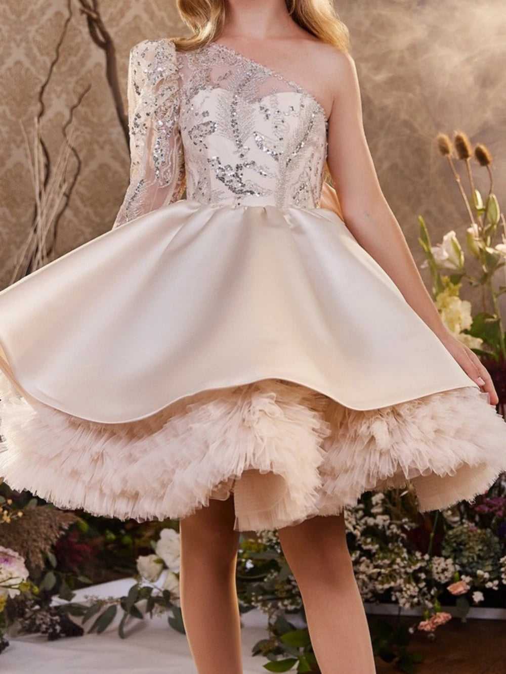 Girl wearing an Ansoff one-shoulder long sleeve glitter sequined princess gown for stage performance or birthday party.
