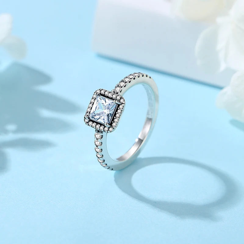 Sterling silver rings for women featuring a crown, love heart, wishbone, and crystal accents in rose gold, luxury jewelry by Ansoff.