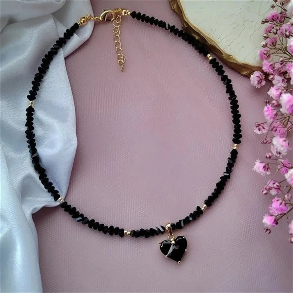 Ansoff vintage zircon heart pendant necklace for women, featuring transparent crystals and boho geometric chain jewelry.