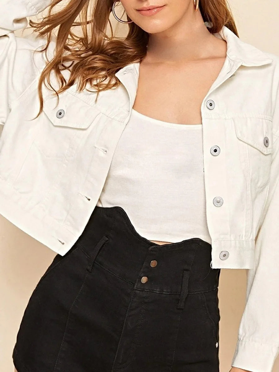 Women’s casual crop denim jacket by Ansoff featuring long sleeves, tassels, button closure, and lightweight jean fabric.