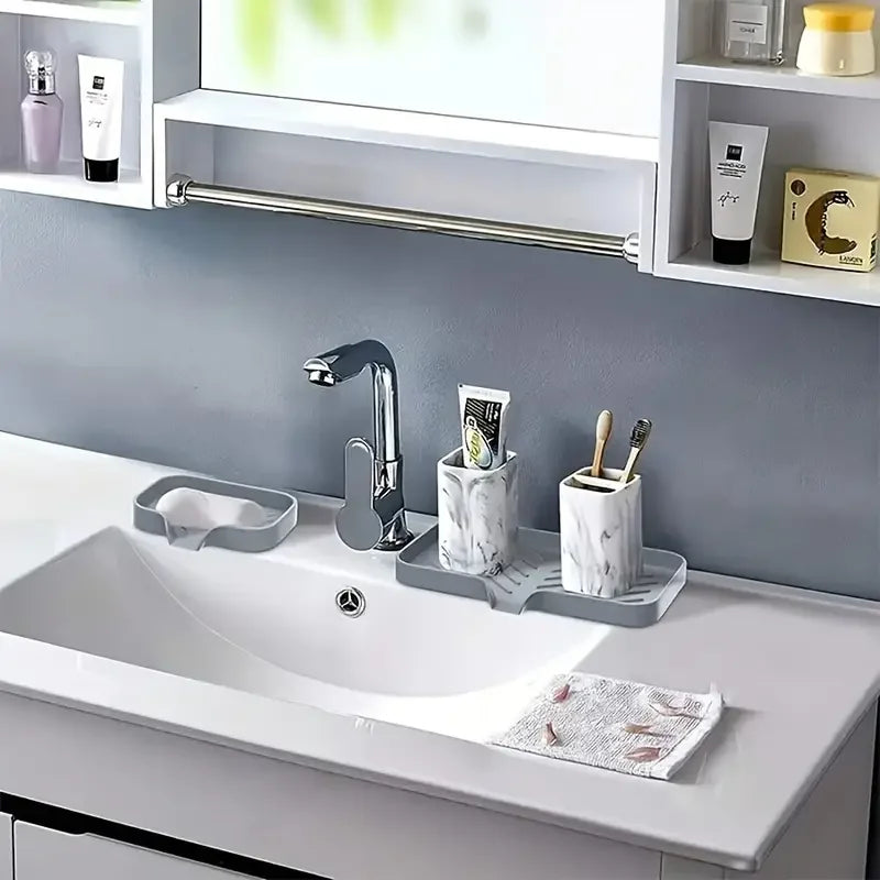 Ansoff silicone kitchen sink faucet mat with soap dispenser, sponge drain tray, and splash drying pad on countertop.