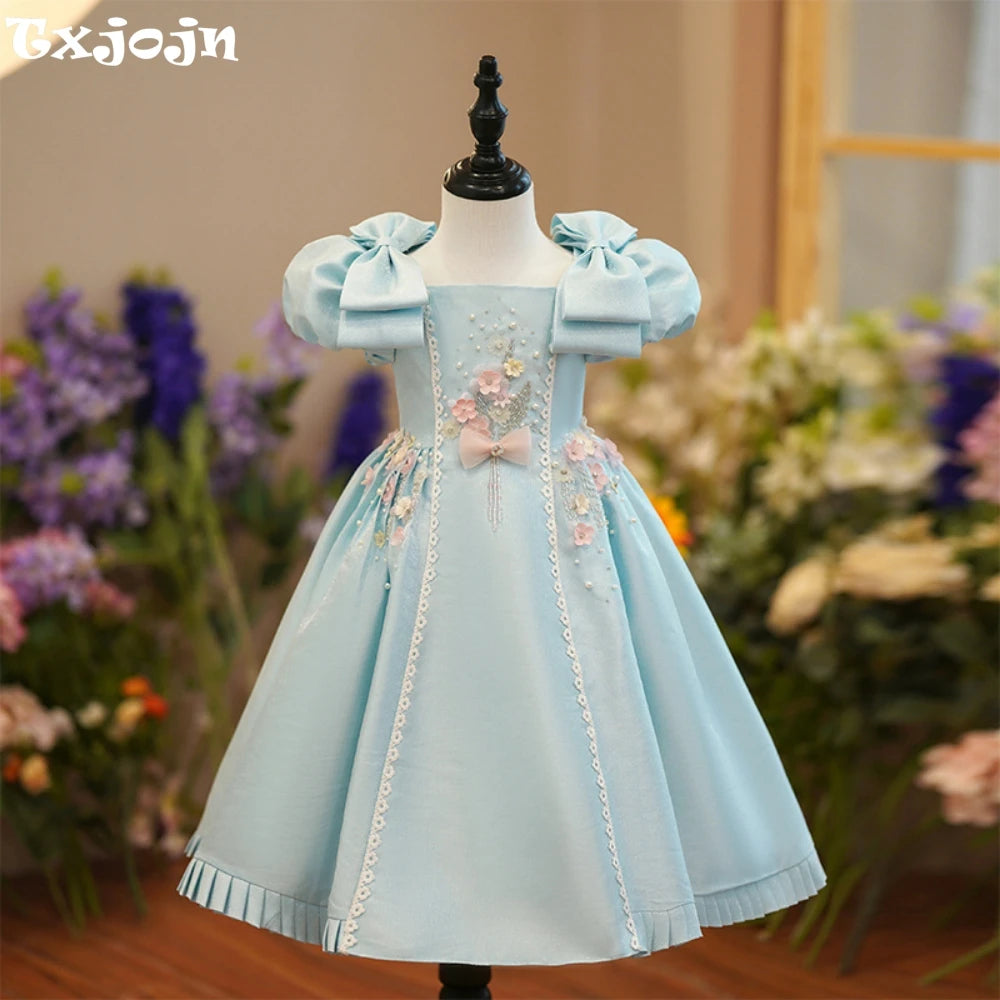 Light blue square neck puff sleeve A-line dress for girls by Ansoff, featuring beads, perfect for parties and performances.