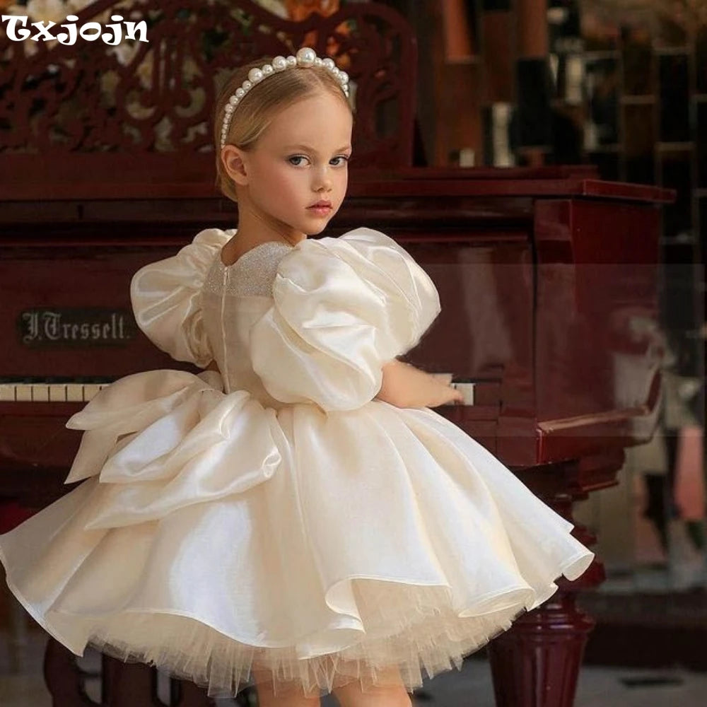 Ansoff glitter puffy tulle ball gown for flower girl, with O-neck, bow, and floral details, perfect for weddings and special occasions.