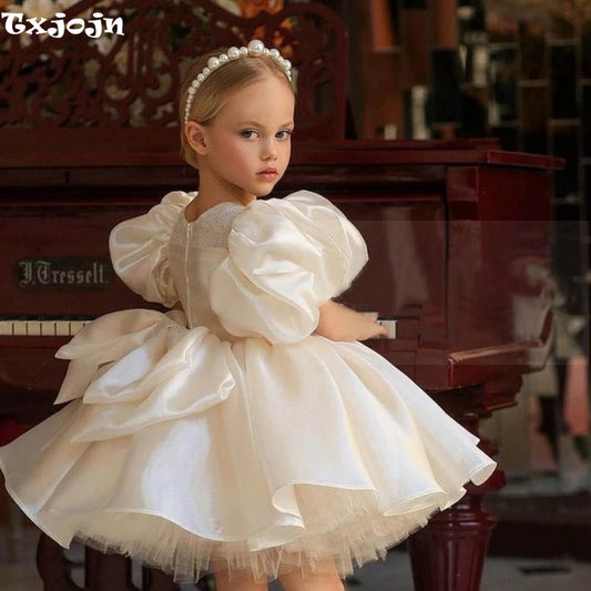 Ansoff glitter puffy tulle ball gown for flower girl, with O-neck, bow, and floral details, perfect for weddings and special occasions.