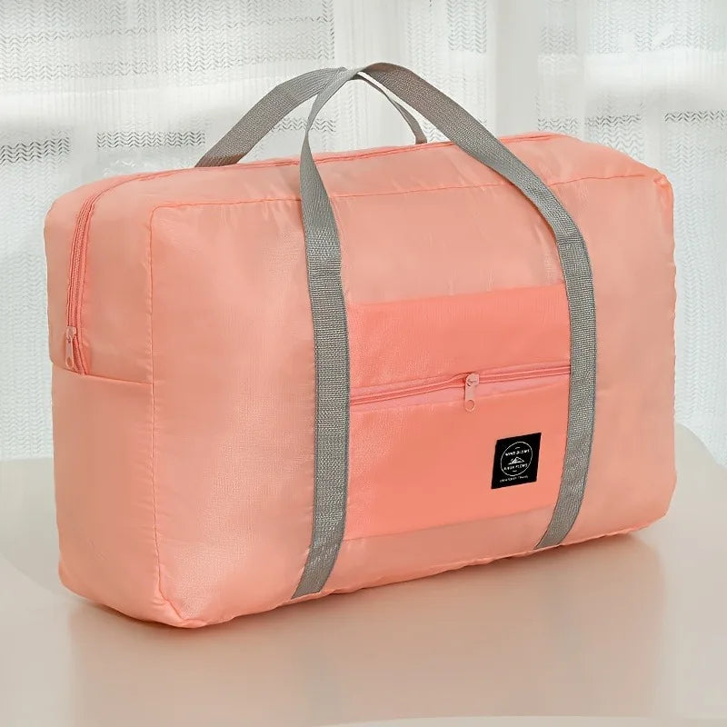 Ansoff foldable large capacity travel luggage bag, expandable sports carry-on and weekend check-in bag with sturdy handles.