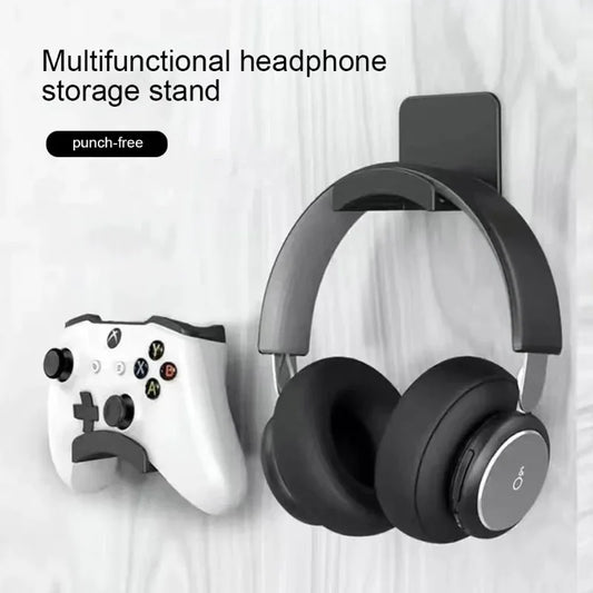 Ansoff universal headphone stand mounted on wall, adhesive plastic hanger holding gaming earphones and headset under desk.