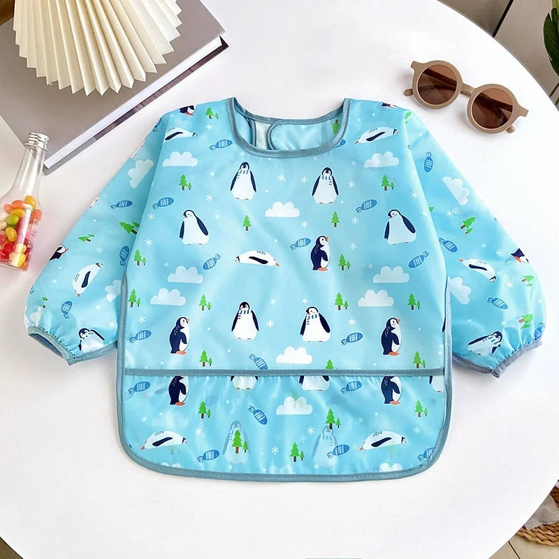 Ansoff waterproof baby bib for girls and boys with long sleeves, cartoon design, adjustable feeding cloth for toddlers' mealtimes.