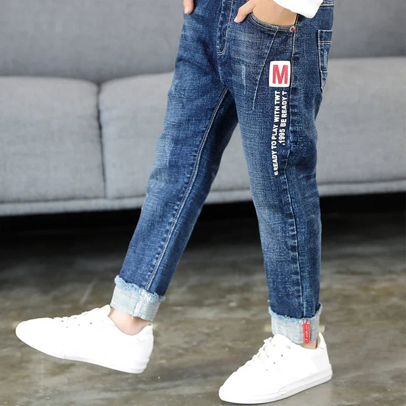 Kids boys denim jeans by Ansoff, cowboy-style sports pants with pockets, size 4 to 12, casual children’s denim trousers.