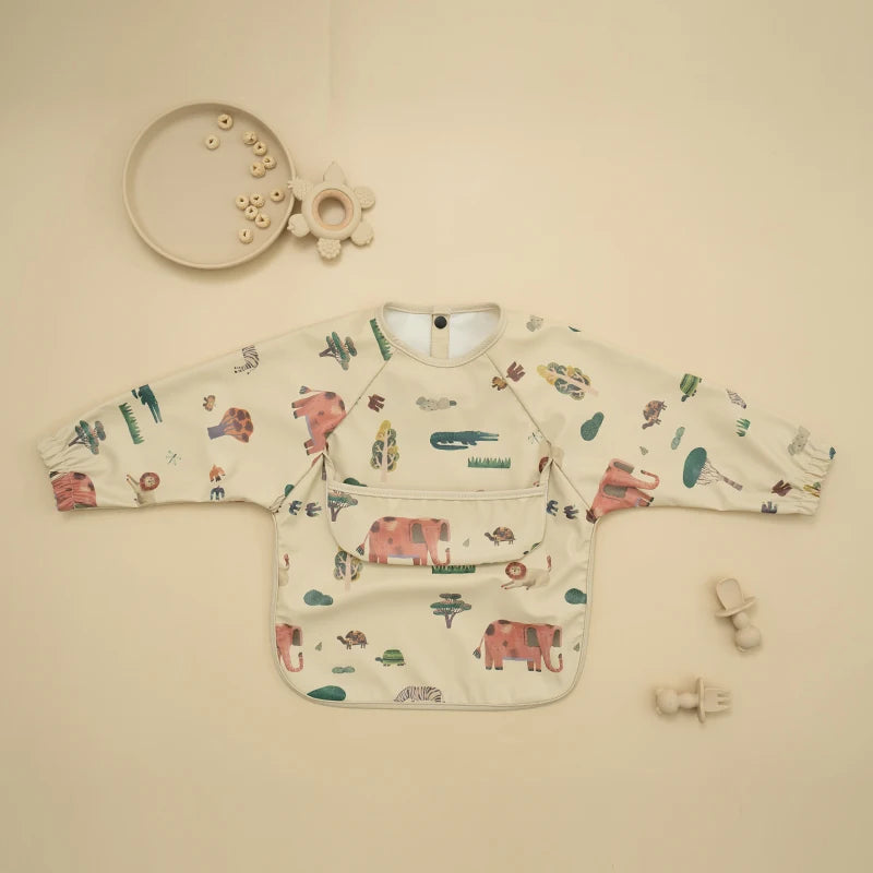 Ansoff infant feeding bibs with long sleeves, printed art design, waterproof fabric, and a front pocket for baby dining protection.