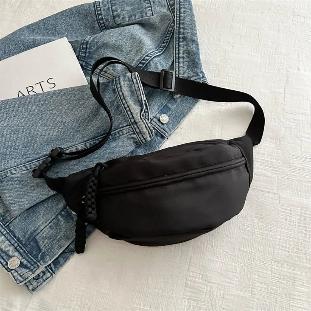 Ansoff large capacity nylon crossbody handbag with adjustable belt, casual solid color chest bag suitable for travel and daily use.