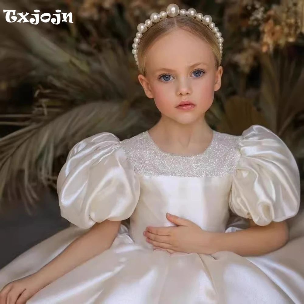 Ansoff glitter puffy tulle ball gown for kids, featuring an O-neck, bow, and floral details, ideal for flower girl or princess dress.
