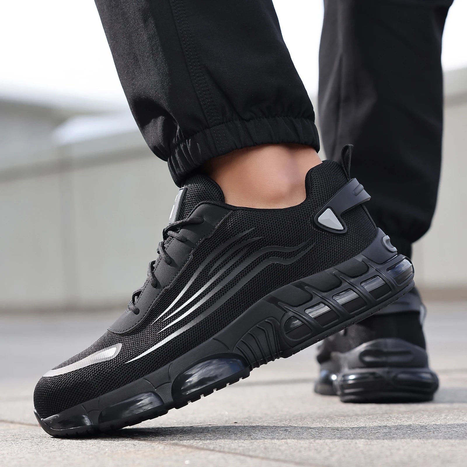 Ansoff men's work shoes with TPU sole, lightweight design, anti-shock and anti-stab features, suitable for all seasons.