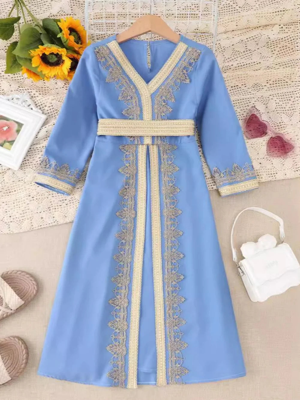 Girls blue Muslim dress with gold lace embroidery, long abaya robe, V-neck, belt, suitable for Eid and prayer occasions.