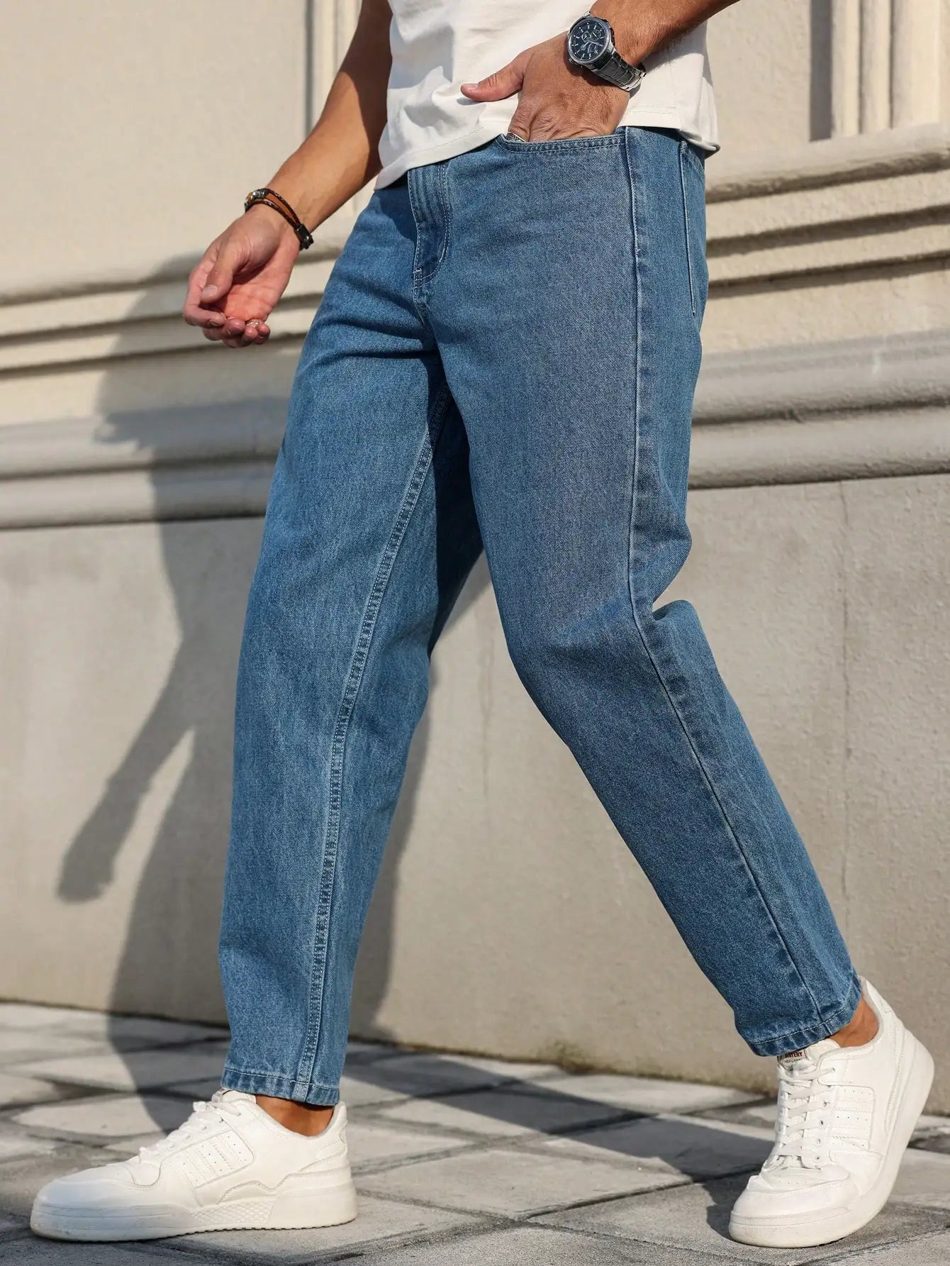 Men's blue denim jeans by Ansoff with a loose fit, showcasing classic denim fabric and versatile style.