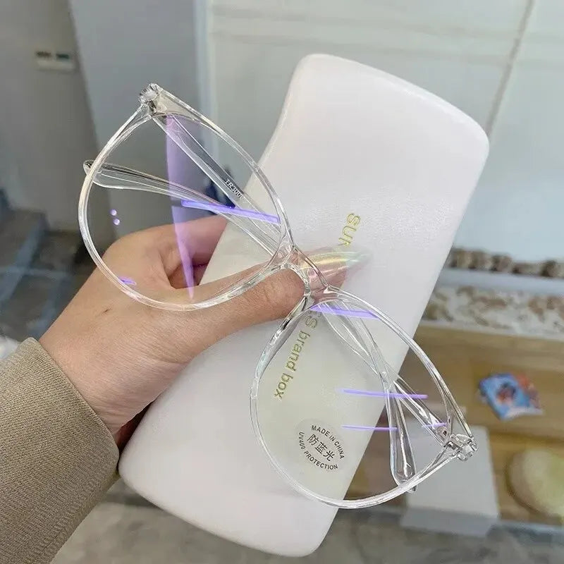 Clear blue light blocking glasses by Ansoff with replaceable lenses, designed for women and men, reducing eye strain from screens.