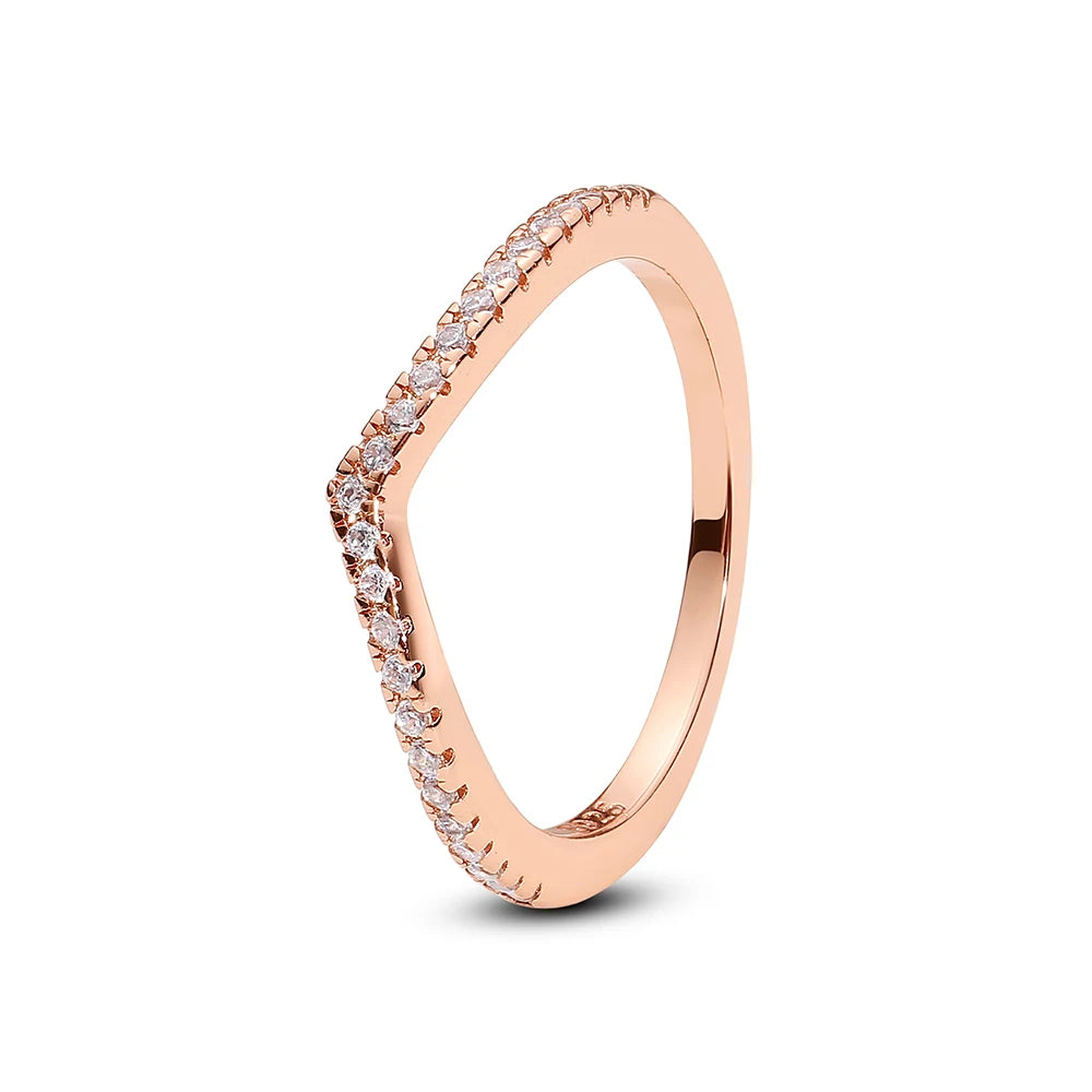 Sterling silver rings for women featuring a crown, love heart, wishbone, and rose gold accents with crystals, by Ansoff.