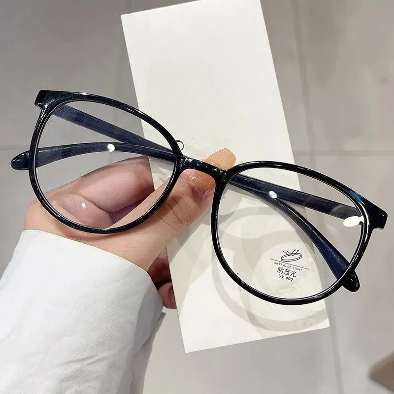 Clear anti-blue light glasses by Ansoff with replaceable lenses, designed for women and men to block radiation and reduce eye strain.
