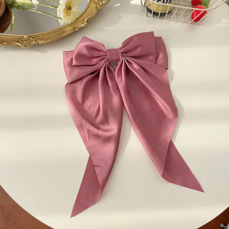 Ansoff Korean hair accessories featuring large satin bowknot clips with long ribbons, spring clamps for women and girls.