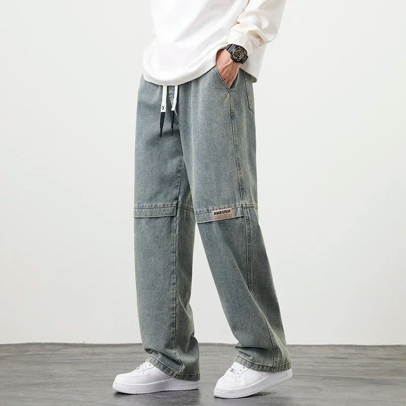 Ansoff men's wide-leg washing jean pants in neutral color, large 8XL size, casual straight outdoor fashion trousers.